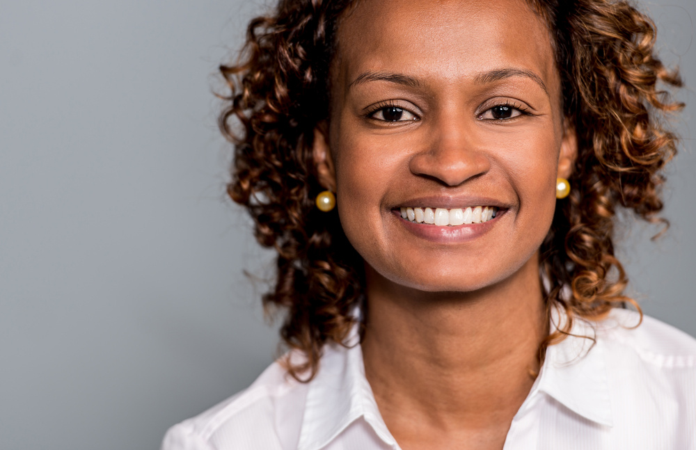 Portrait of a black business woman looking very happy